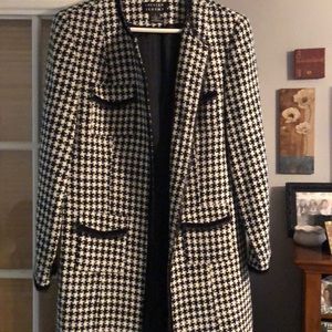 Black and white check knee length coat